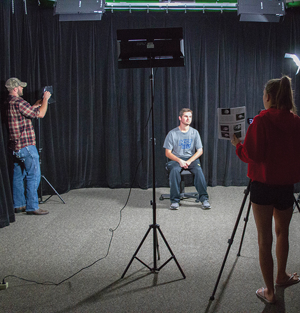 MSJ students filming a student interview in video production lab.
