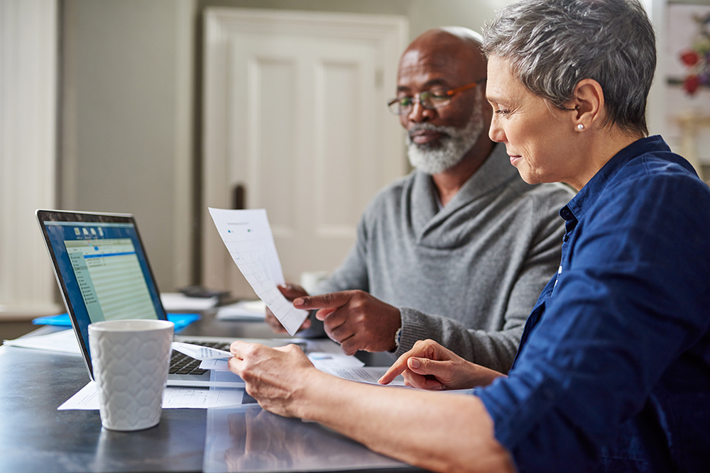 people reviewing financial papers
