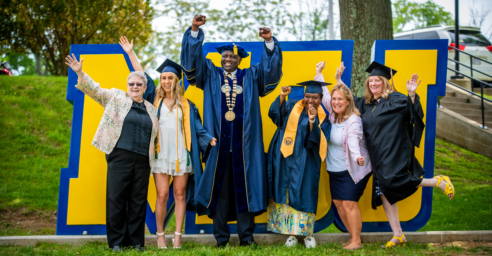 graduates by msj statue