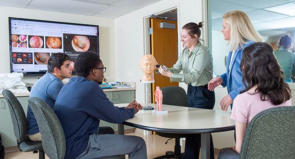 Mount St. Joseph University MSLP students in classroom with hearing equipment.