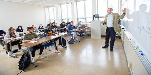professor in classroom with students