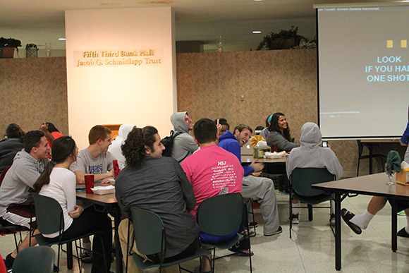 students sitting and laughing in fifth third dining hall to take a break from finals during exam jam.