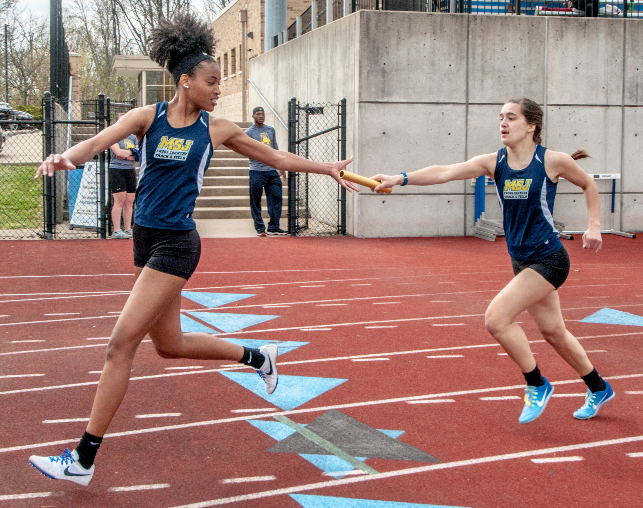 female track athlete running on track