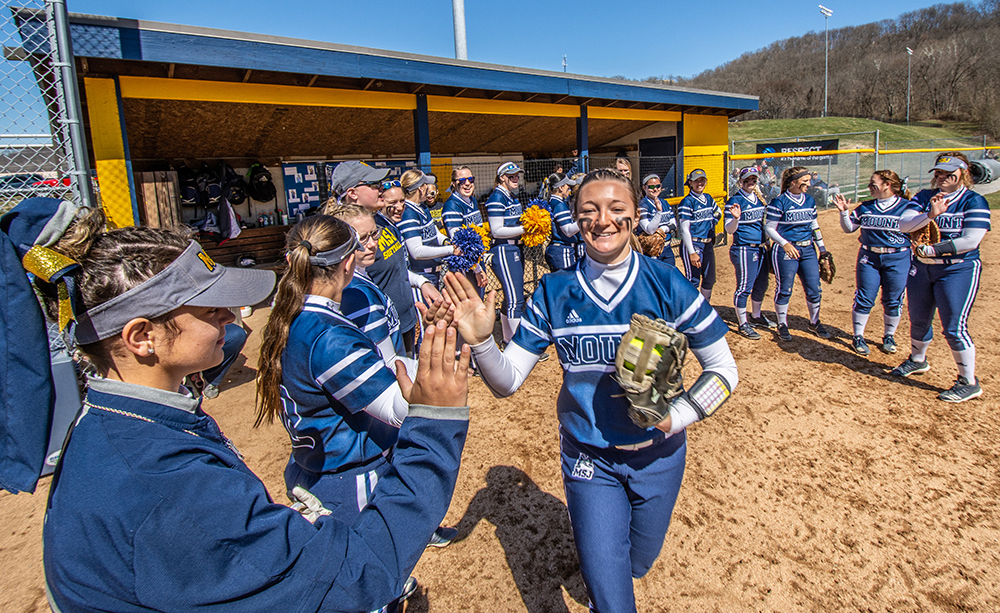 softball team high-fiving 