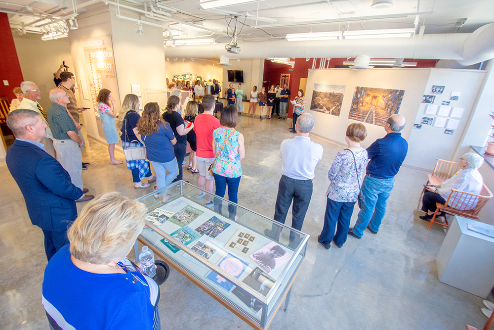 crowd standing together in studio