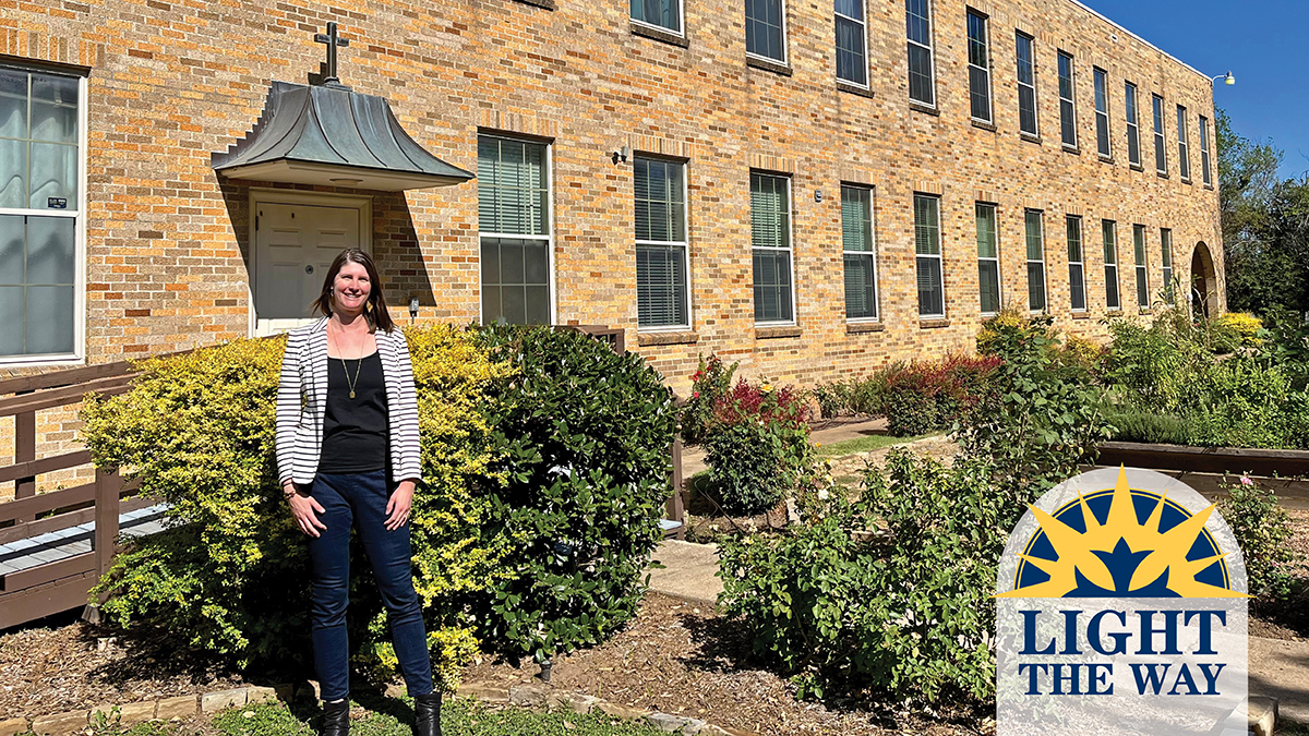 maria eichhold standing next to building outside.