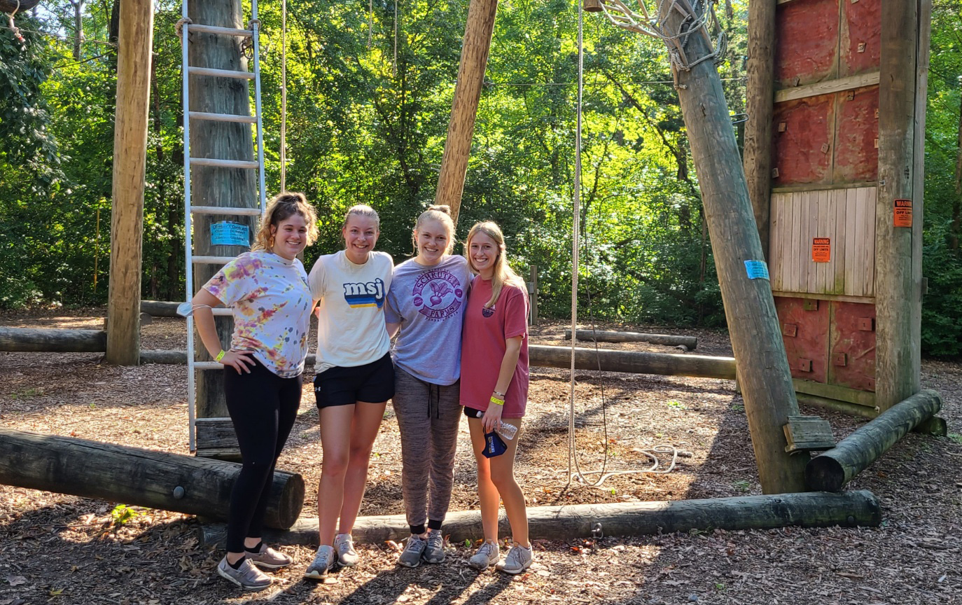 mission ambassadors from mount st. joseph university smiling outside.