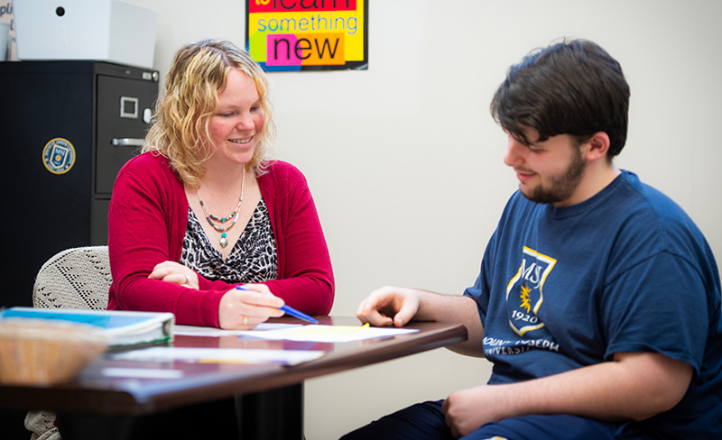 tutor helping student