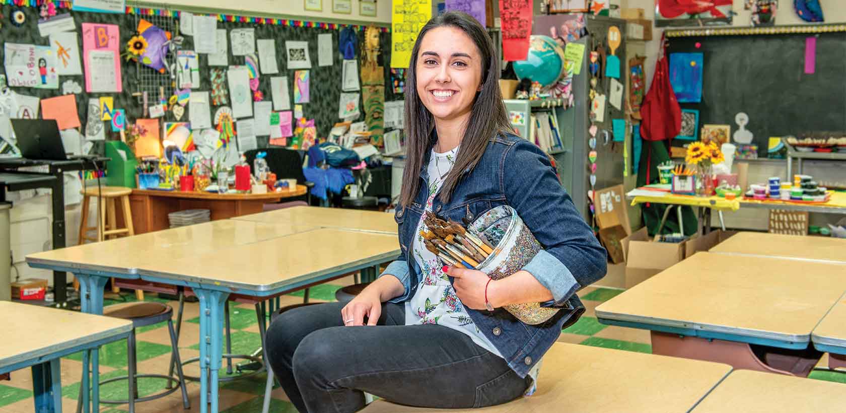 art education major sitting at a desk