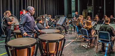 Students perform a concert on the University Theatre stage.