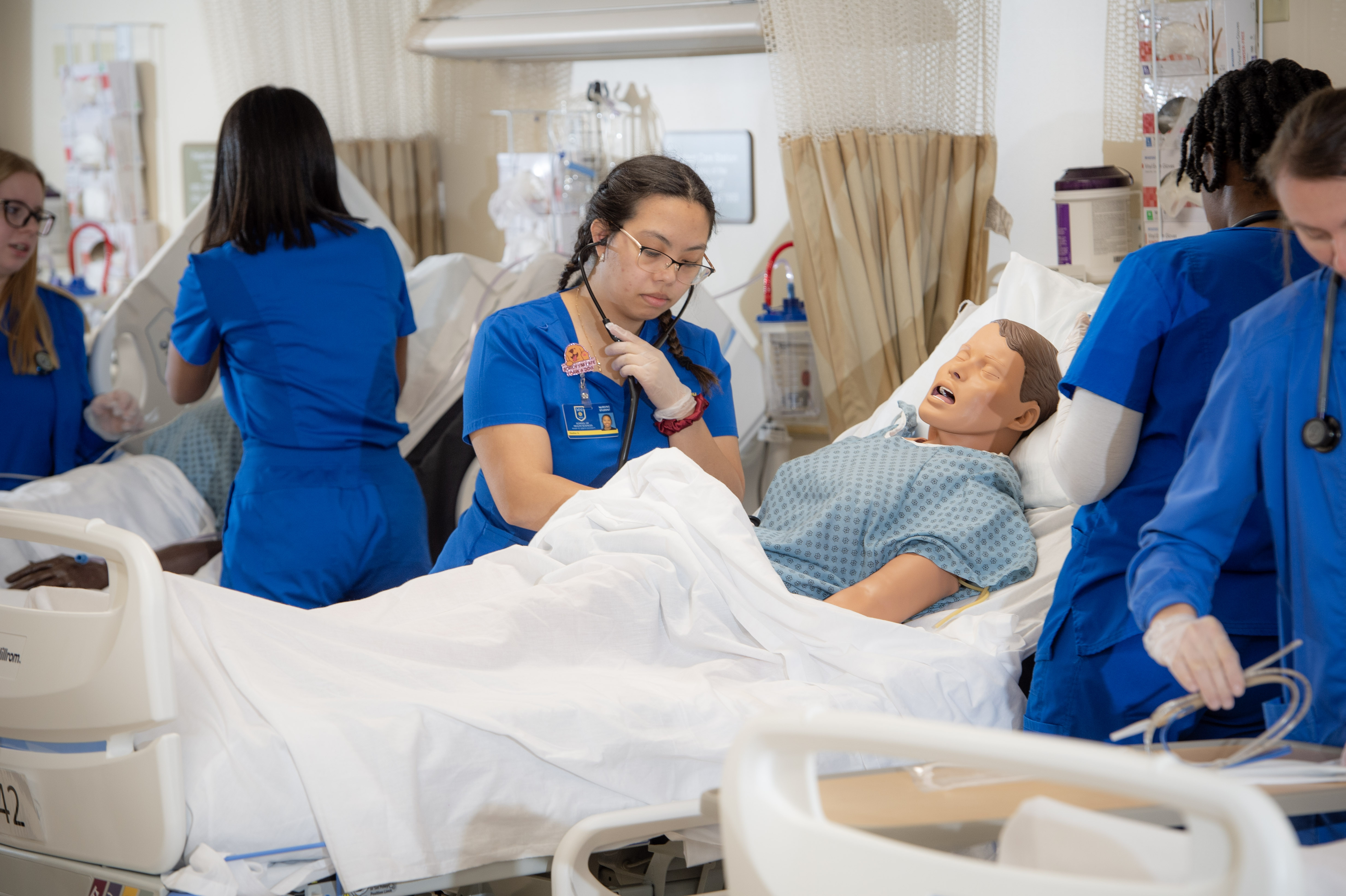 nursing students by bedside