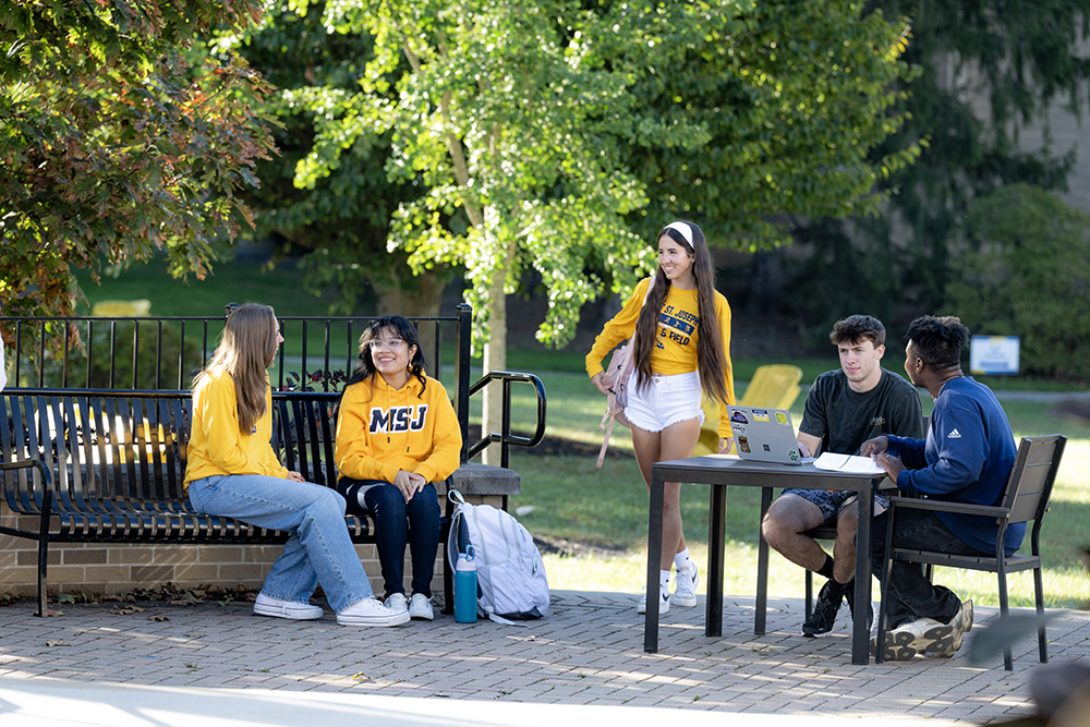 students outside talking