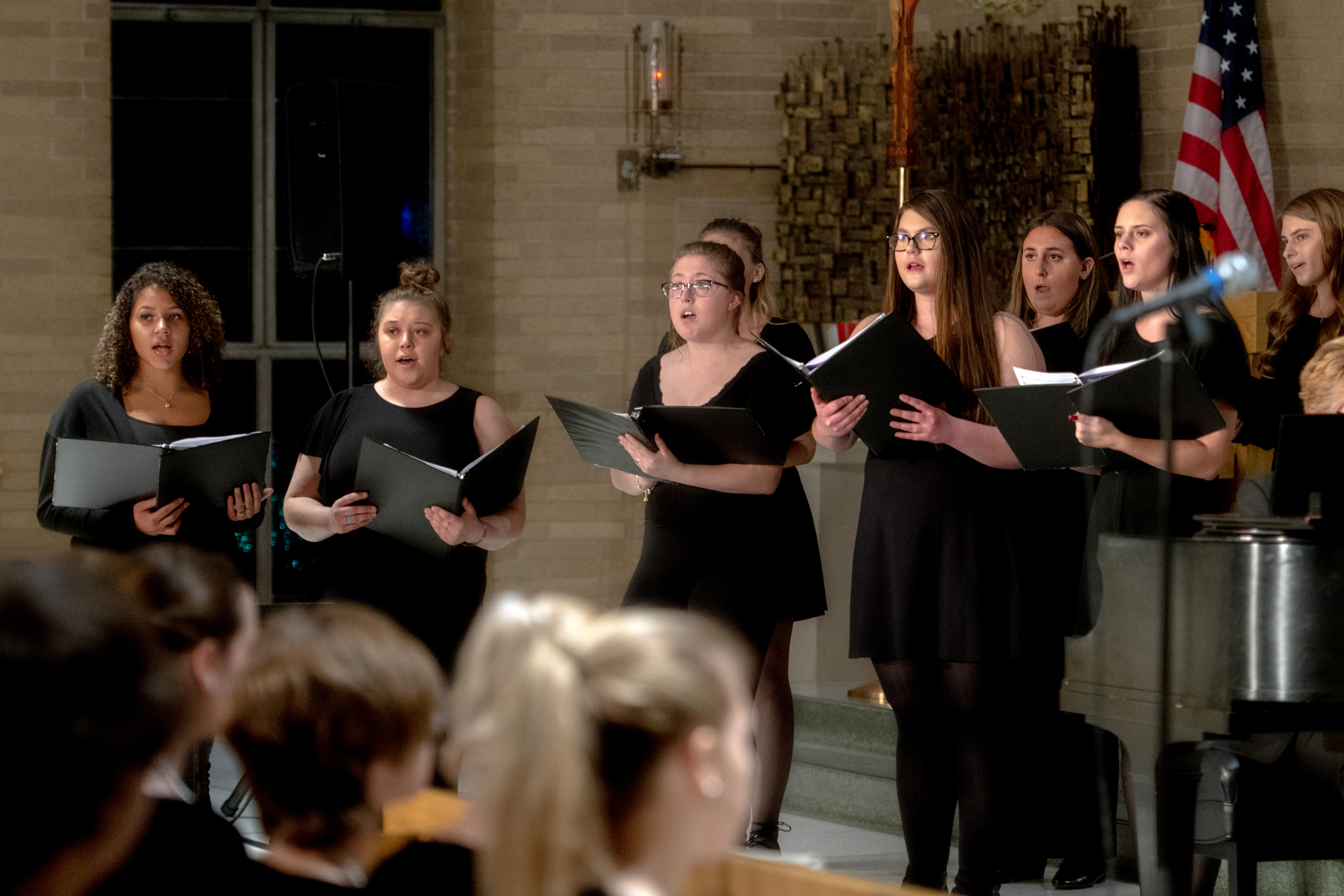 students singing on stage