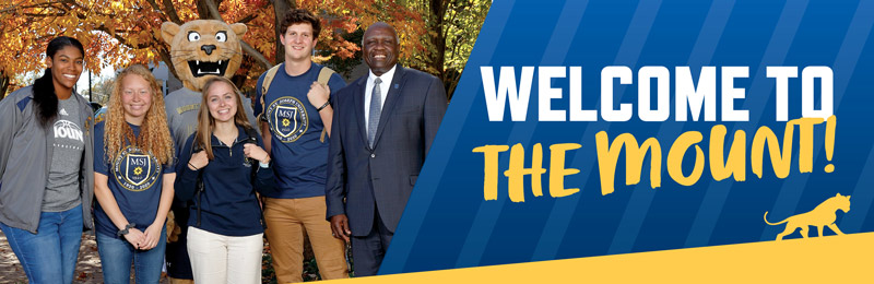 Image of Mount St. Joseph University students with President Williams outside the Seton Center