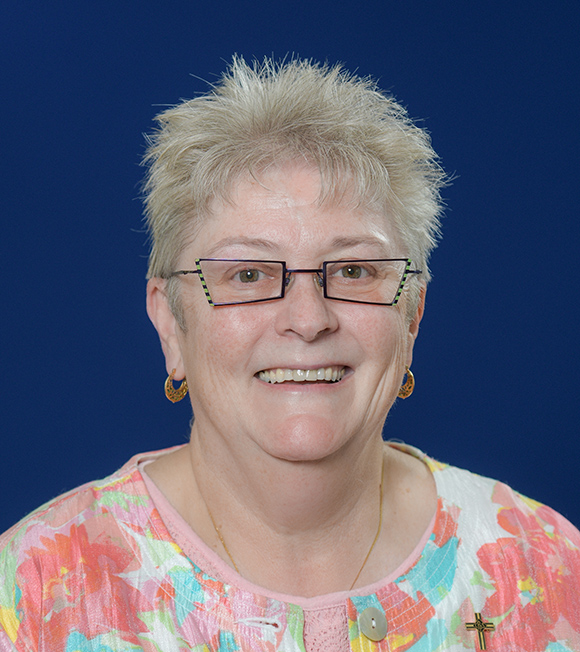 headshot photo of sister karen elliott smiling.