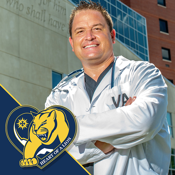 man crossing arms and smiling in front of hospital