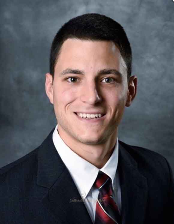 headshot of alumnus zach gerber smiling