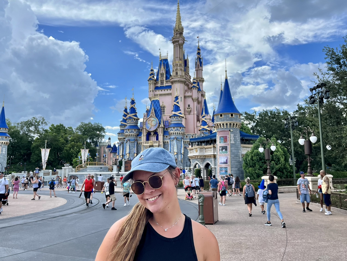 Mount St. Joseph University student with disney mouse hat on campus