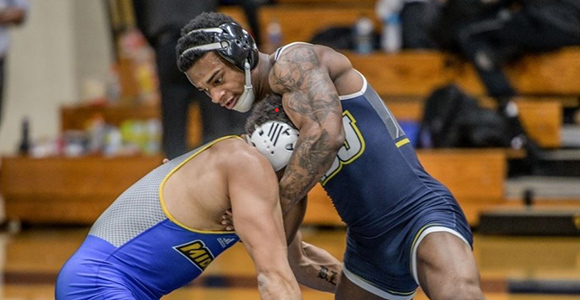 cornell beachem in wrestling tournament pinning down opponent.