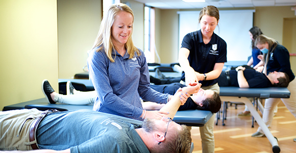 MSJ physical therapy students working on clinicals in PT clinic.