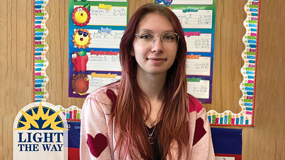 female student smiling in classroom