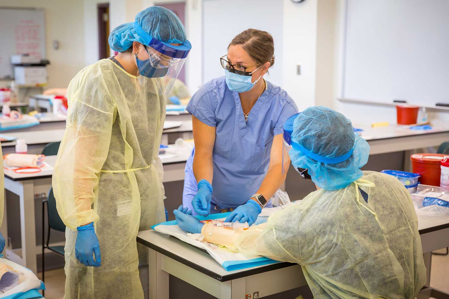 Photo of Physician Assistant students completing a lab. 