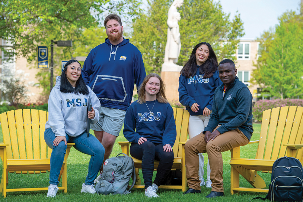 students sitting in quad