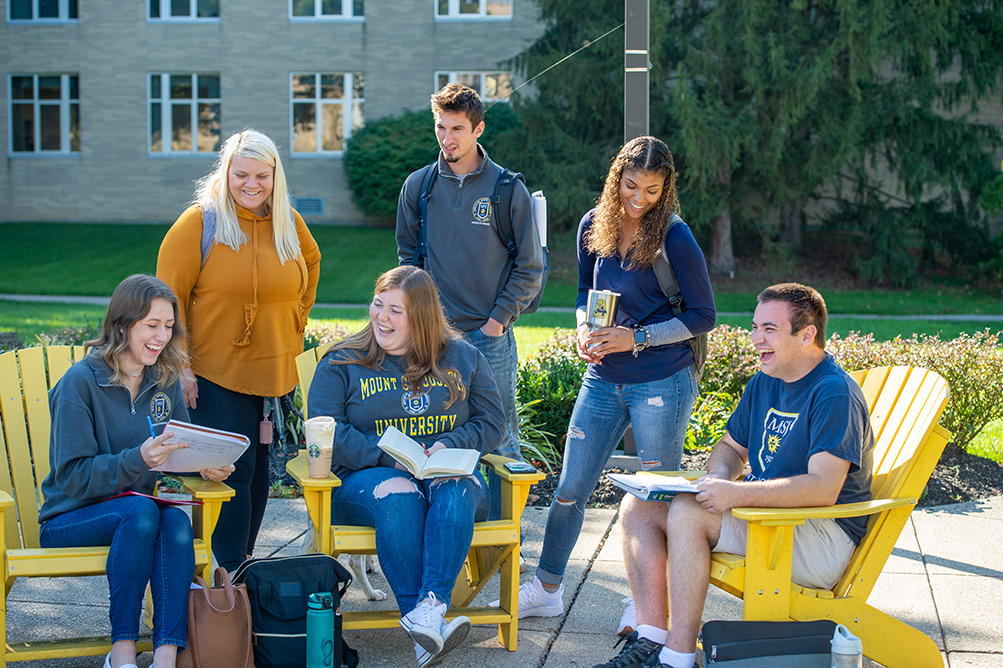 MSJ students talking and doing homework in MSJ quad.