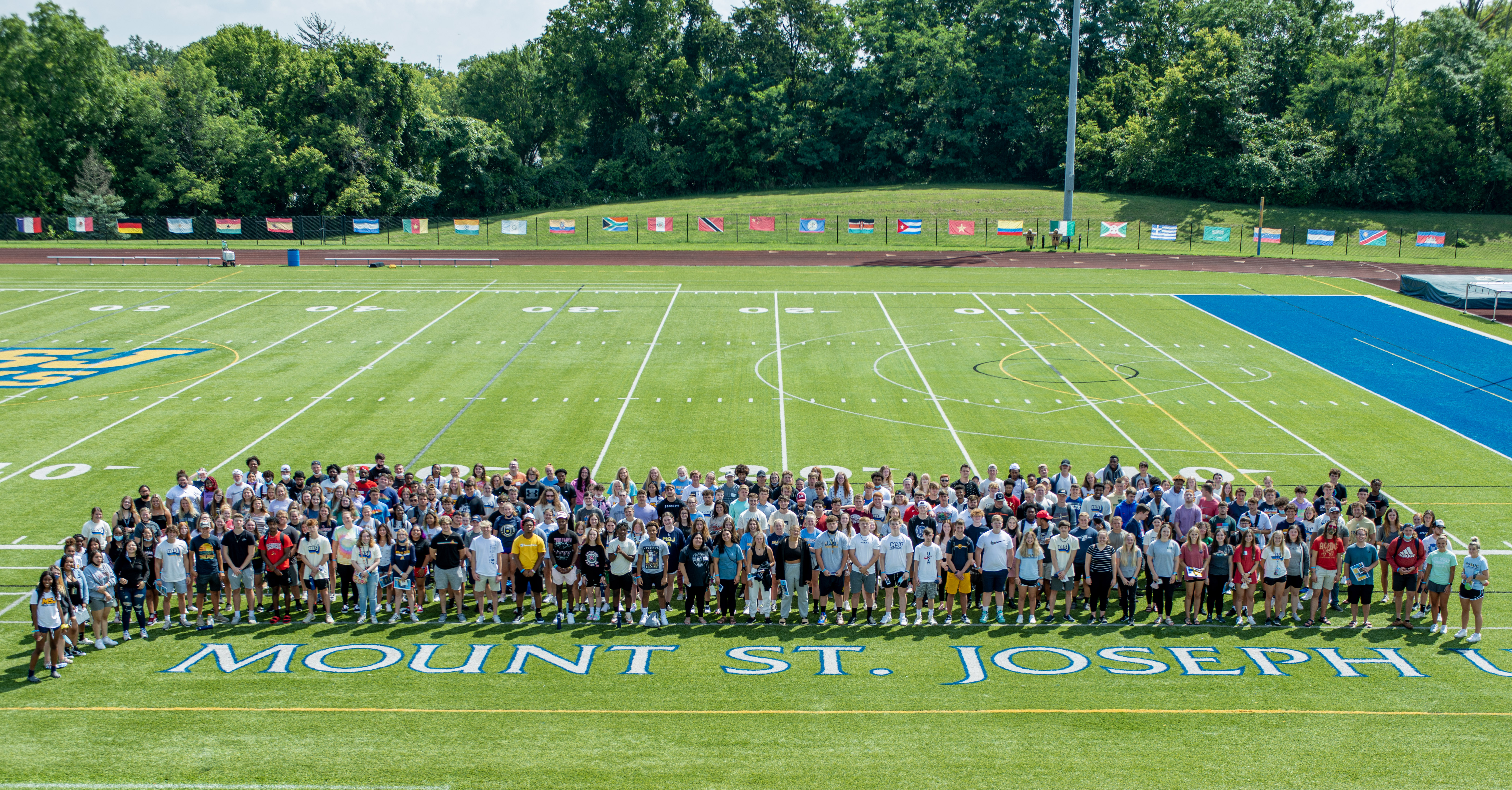 2021 freshmen class standing in football field