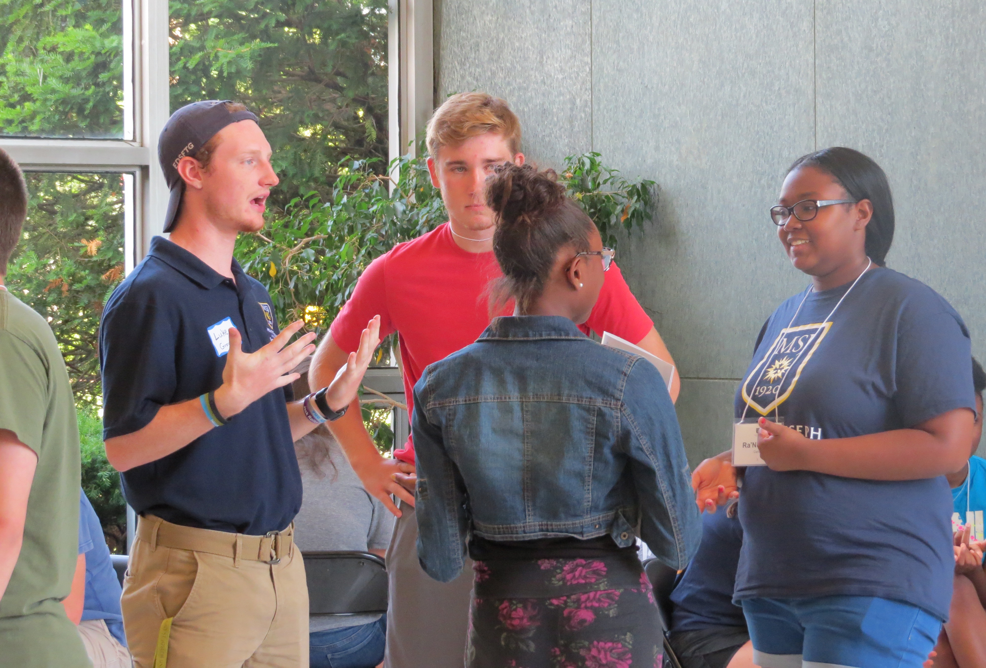 group of students standing together talking